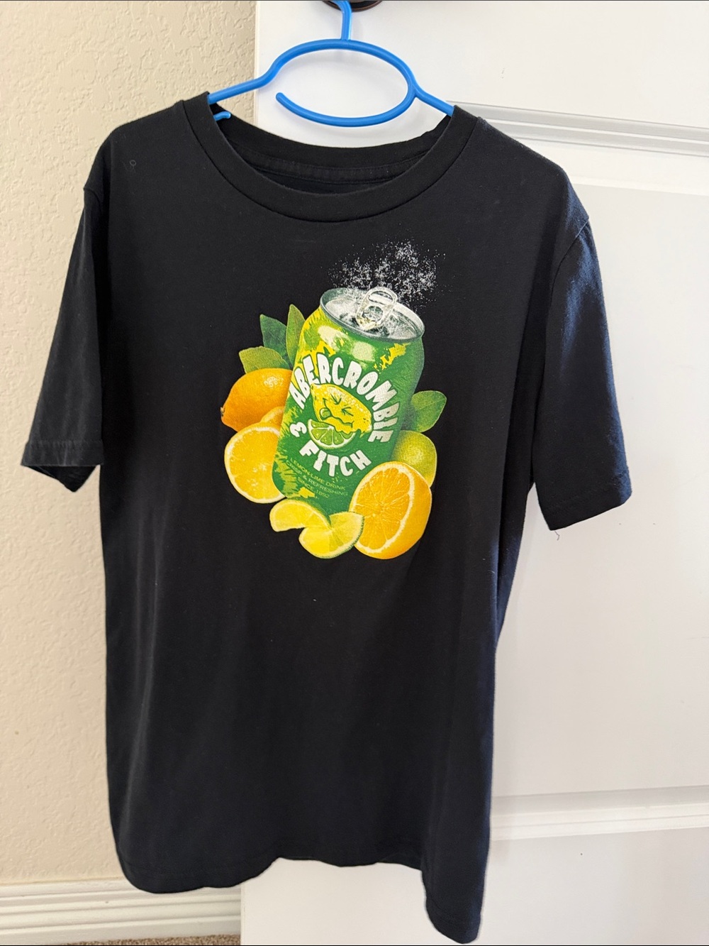 Abercrombie Kids Black Tee with Green & Yellow Citrus Can Graphic